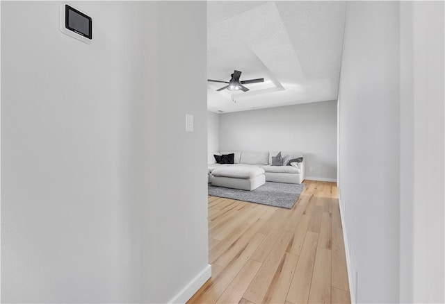 252 SE 23rd Hwy, Knob Noster, MO 65336 - living area with light wood-style flooring, baseboards, and a ceiling fan