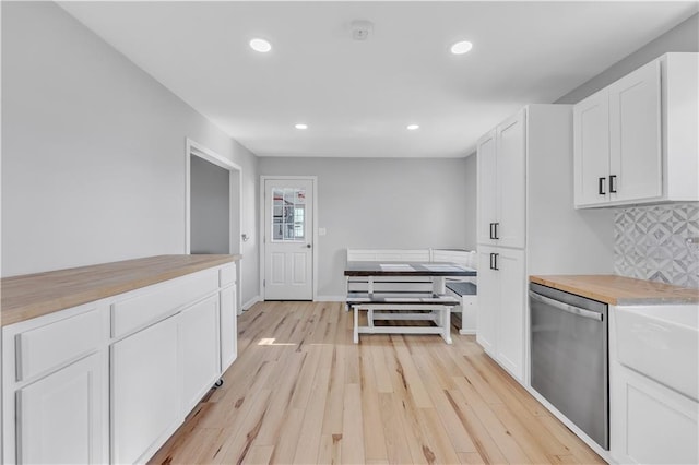 252 SE 23rd Hwy, Knob Noster, MO 65336 - kitchen with dishwasher, light wood-type flooring, recessed lighting, white cabinetry, and decorative backsplash