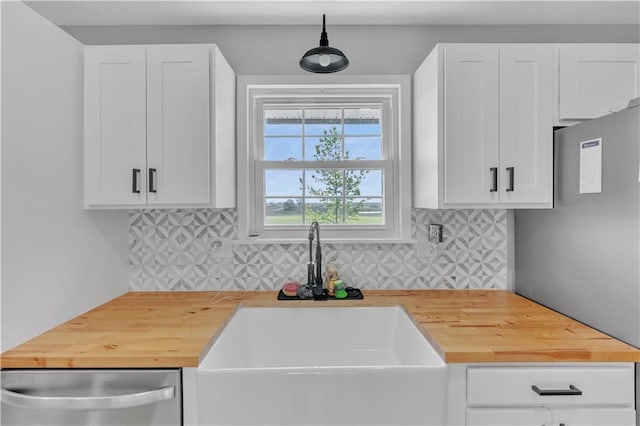 252 SE 23rd Hwy, Knob Noster, MO 65336 - kitchen featuring wood counters, a sink, stainless steel appliances, and decorative backsplash