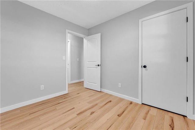 252 SE 23rd Hwy, Knob Noster, MO 65336 - unfurnished bedroom with wood finished floors and baseboards