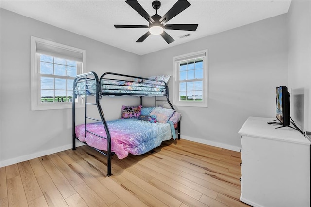 252 SE 23rd Hwy, Knob Noster, MO 65336 - bedroom featuring baseboards, wood finished floors, and a ceiling fan