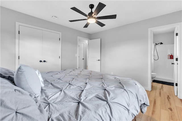 252 SE 23rd Hwy, Knob Noster, MO 65336 - bedroom featuring light wood finished floors, a closet, ensuite bathroom, a ceiling fan, and baseboards