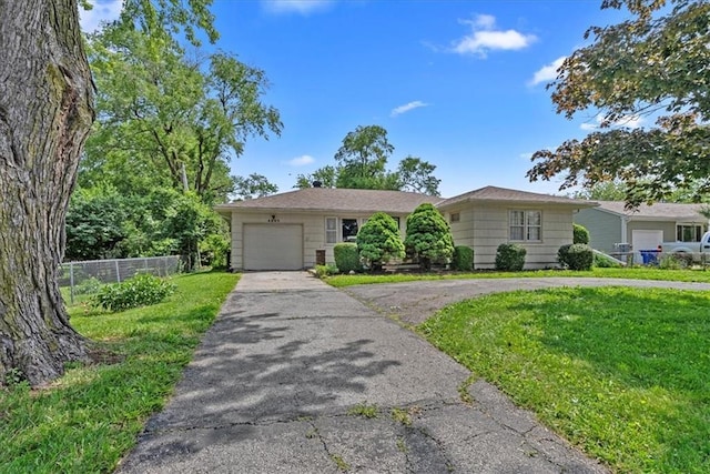 4305 Doctor Greaves Rd, Grandview, MO 64030 - single story home featuring a garage and asphalt driveway