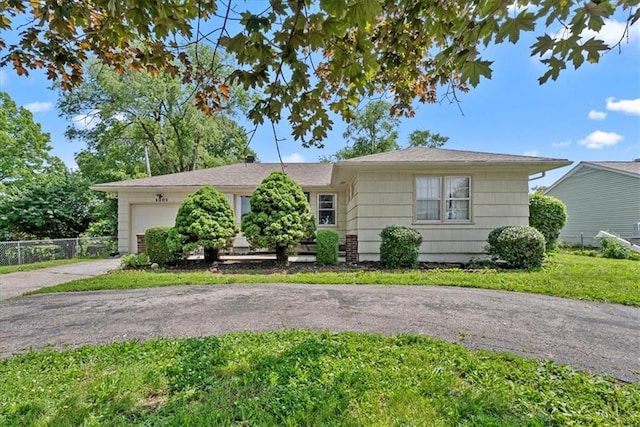 4305 Doctor Greaves Rd, Grandview, MO 64030 - ranch-style house featuring a garage and driveway