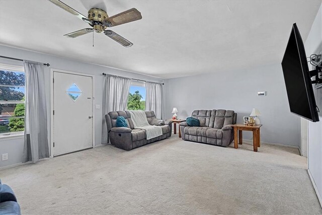 4305 Doctor Greaves Rd, Grandview, MO 64030 - living room featuring ceiling fan, carpet flooring, and baseboards