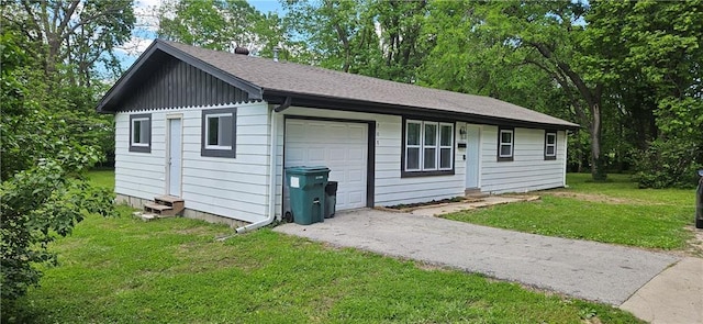 708 S Gay St, Holden, MO 64040 - view of front facade with a front lawn, asphalt driveway, a garage, and entry steps