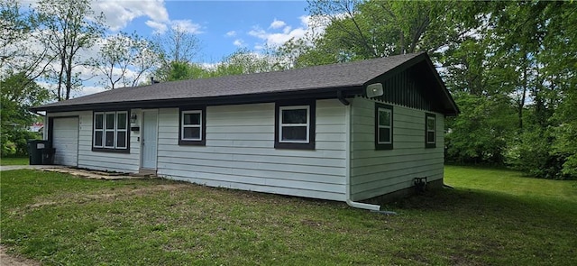 708 S Gay St, Holden, MO 64040 - view of front of home with an attached garage, a front lawn, and driveway