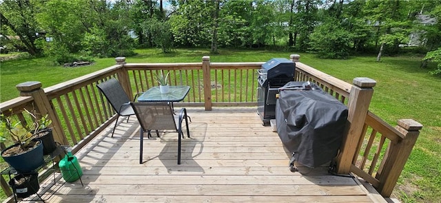 708 S Gay St, Holden, MO 64040 - deck with a lawn, view of scattered trees, and grilling area