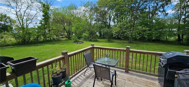 708 S Gay St, Holden, MO 64040 - wooden terrace with a grill, a lawn, and view of scattered trees