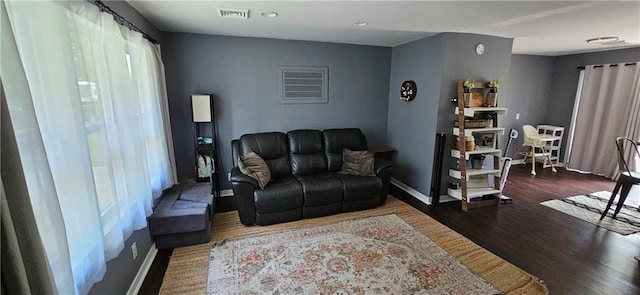 708 S Gay St, Holden, MO 64040 - living area featuring wood finished floors, baseboards, and recessed lighting