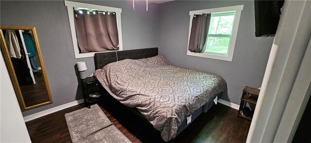 708 S Gay St, Holden, MO 64040 - bedroom with wood finished floors and baseboards