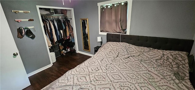 708 S Gay St, Holden, MO 64040 - bedroom with wood finished floors, baseboards, and a closet
