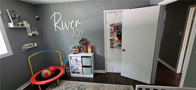 708 S Gay St, Holden, MO 64040 - recreation room with wood finished floors and baseboards