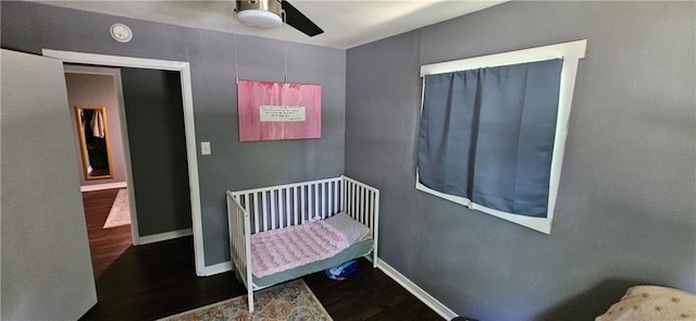 708 S Gay St, Holden, MO 64040 - bedroom with wood finished floors, baseboards, and ceiling fan