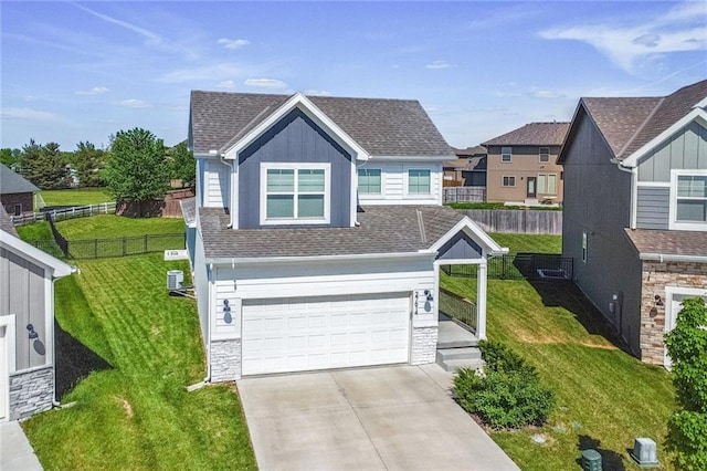 view of front of home featuring an attached garage, stone siding, concrete driveway, roof with shingles, and central AC