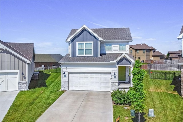 craftsman inspired home with board and batten siding, stone siding, driveway, and a garage