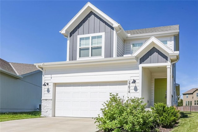 view of front of home featuring a garage, driveway, and board and batten siding