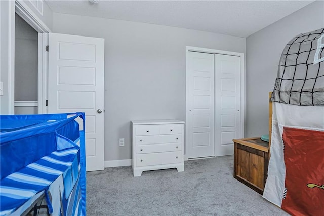 bedroom featuring carpet floors and a closet