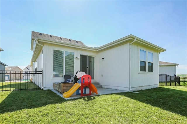 rear view of property featuring a patio