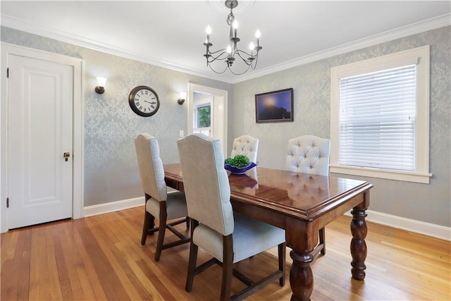 23 W Winthrope Rd, Kansas City, MO 64113 - dining room featuring light wood finished floors, a chandelier, baseboards, crown molding, and wallpapered walls