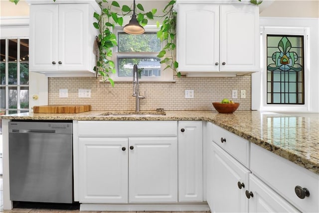 23 W Winthrope Rd, Kansas City, MO 64113 - kitchen featuring dishwasher, a sink, decorative backsplash, and white cabinetry
