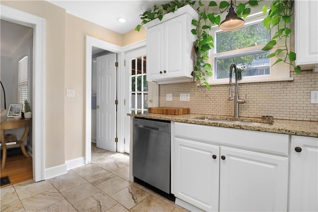 23 W Winthrope Rd, Kansas City, MO 64113 - kitchen featuring stainless steel dishwasher, a sink, baseboards, and tasteful backsplash