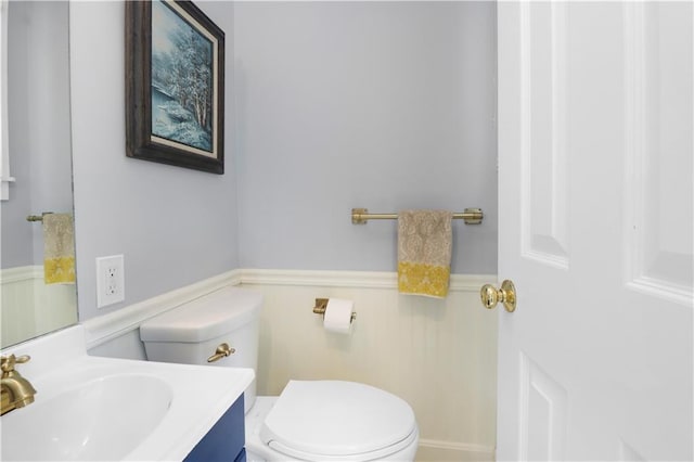 23 W Winthrope Rd, Kansas City, MO 64113 - half bath with toilet, vanity, and a wainscoted wall