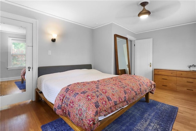 23 W Winthrope Rd, Kansas City, MO 64113 - bedroom featuring wood finished floors, ornamental molding, ceiling fan, and baseboards
