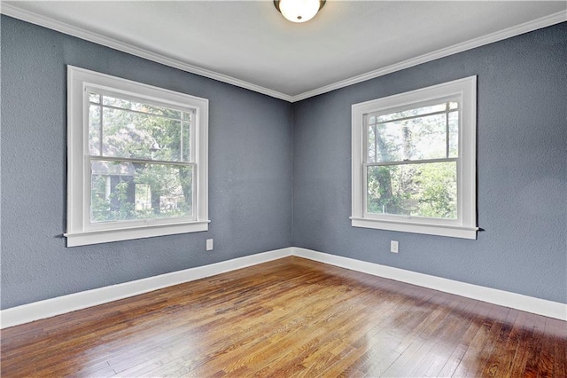 2414 N 12th St, Kansas City, KS 66104 - unfurnished room with healthy amount of natural light, wood-type flooring, ornamental molding, baseboards, and a textured wall