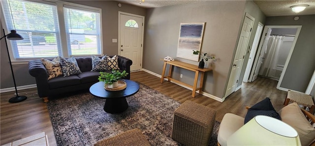 7934 Hemlock St, Overland Park, KS 66204 - living room with baseboards, wood finished floors, and a textured ceiling