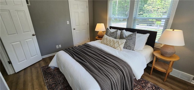 7934 Hemlock St, Overland Park, KS 66204 - bedroom featuring baseboards and dark wood finished floors