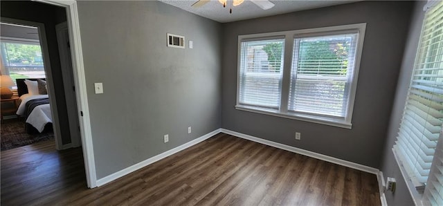 7934 Hemlock St, Overland Park, KS 66204 - unfurnished room with dark wood-style floors, ceiling fan, and baseboards