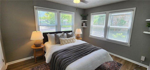 7934 Hemlock St, Overland Park, KS 66204 - bedroom featuring baseboards, wood finished floors, a textured ceiling, and ceiling fan