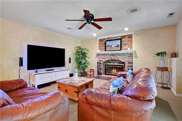 living area with carpet, a ceiling fan, a fireplace, and baseboards