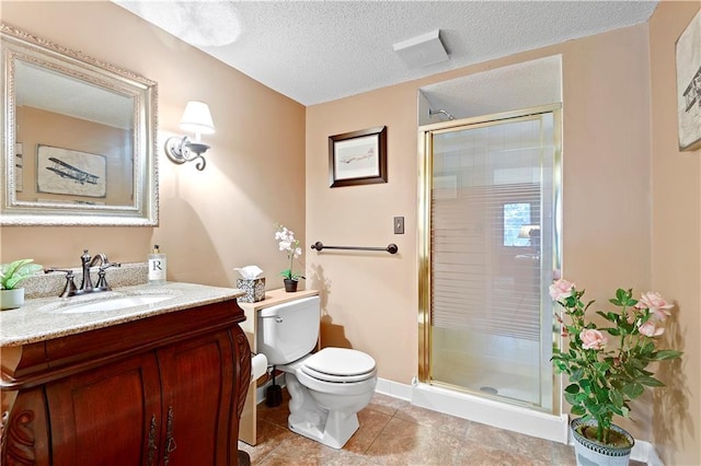 full bath with a stall shower, toilet, vanity, tile patterned flooring, and a textured ceiling