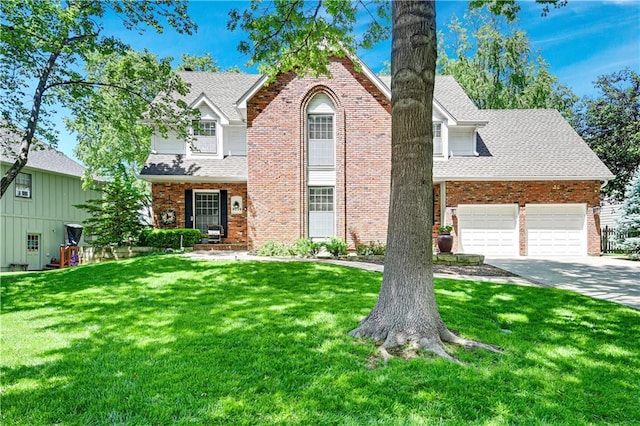 traditional-style home with a front lawn, brick siding, a shingled roof, driveway, and a garage