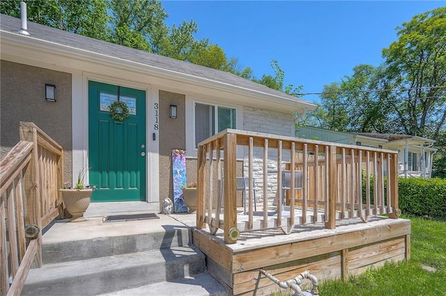 3118 Kimball Ave, Kansas City, KS 66104 - doorway to property featuring stucco siding and a wooden deck