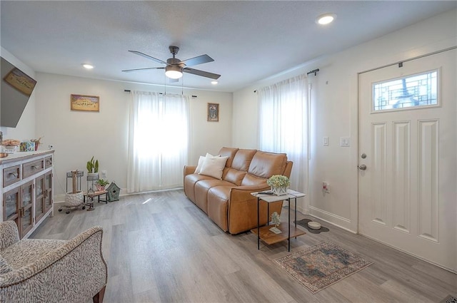3118 Kimball Ave, Kansas City, KS 66104 - living room featuring healthy amount of natural light, ceiling fan, light wood finished floors, and recessed lighting