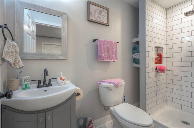 3118 Kimball Ave, Kansas City, KS 66104 - bathroom with toilet, a shower stall, vanity, and baseboards