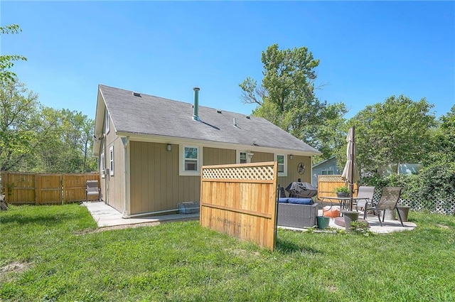 3118 Kimball Ave, Kansas City, KS 66104 - rear view of property featuring a patio area, an outdoor living space, and roof with shingles