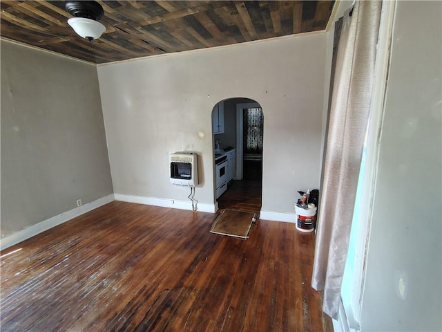 unfurnished living room with heating unit, arched walkways, baseboards, wood-type flooring, and wood ceiling