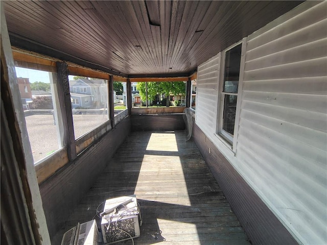 unfurnished sunroom featuring plenty of natural light