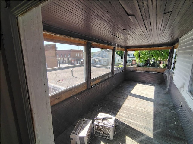 unfurnished sunroom with a residential view