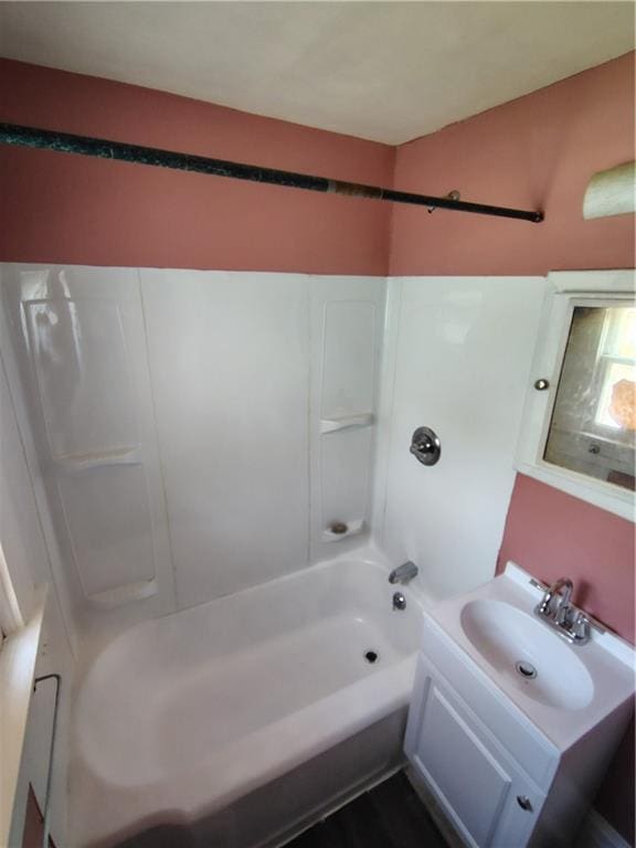 bathroom with vanity and  shower combination