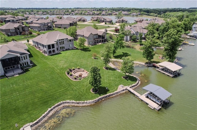 aerial perspective of suburban area with a nearby body of water