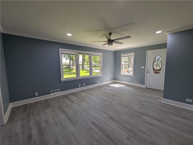 unfurnished living room featuring ceiling fan, baseboards, crown molding, wood finished floors, and recessed lighting