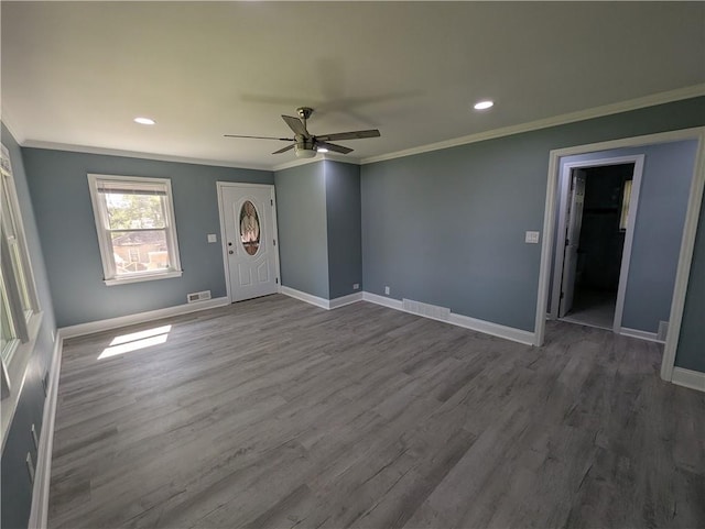 unfurnished living room featuring crown molding, ceiling fan, dark wood-style flooring, recessed lighting, and baseboards