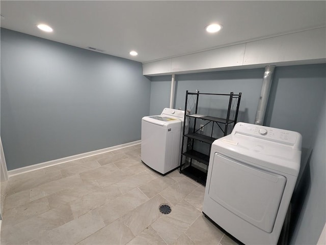 laundry room featuring independent washer and dryer, recessed lighting, and baseboards
