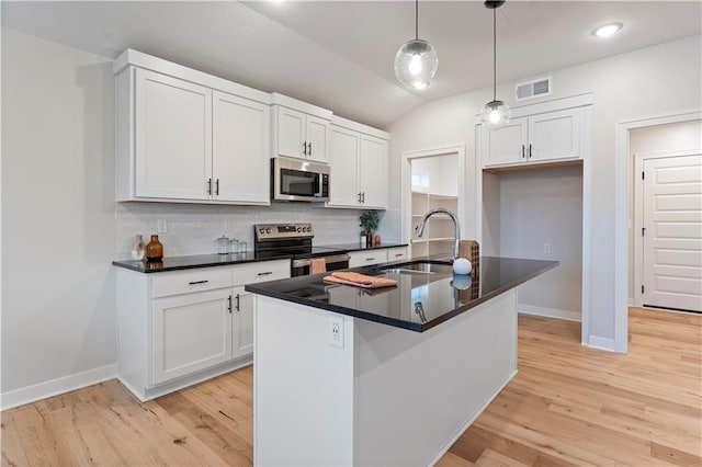 1925 SW Merryman Dr, Lees Summit, MO 64082 - kitchen featuring stainless steel appliances, a sink, dark countertops, baseboards, and backsplash