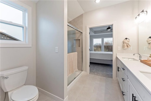 1925 SW Merryman Dr, Lees Summit, MO 64082 - bathroom with ensuite bathroom, toilet, a stall shower, baseboards, and a ceiling fan